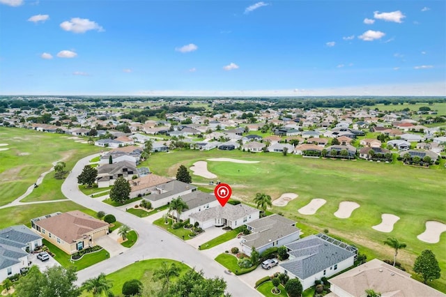 aerial view of residential area with a golf course