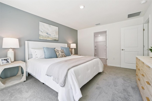 carpeted bedroom featuring baseboards, recessed lighting, and visible vents