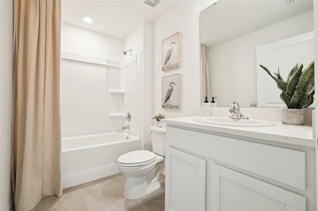 bathroom featuring toilet, vanity, shower / tub combo with curtain, visible vents, and tile patterned floors
