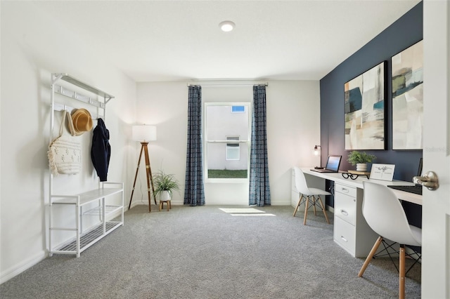 carpeted office featuring baseboards