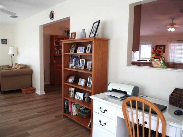 office with a ceiling fan, baseboards, visible vents, and wood finished floors