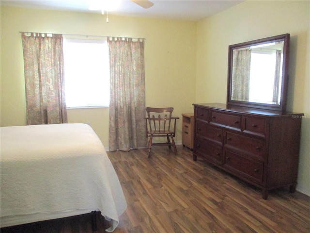 bedroom with a ceiling fan and wood finished floors