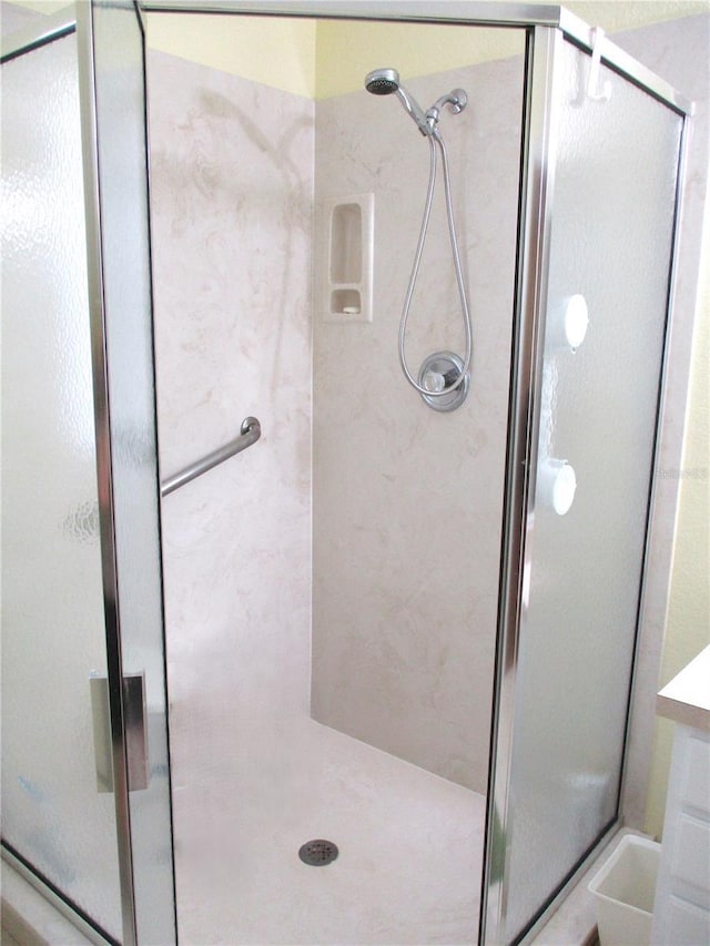full bathroom with a shower stall