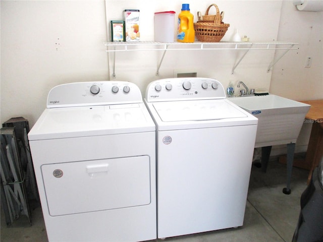 laundry room featuring washer and dryer, laundry area, and a sink