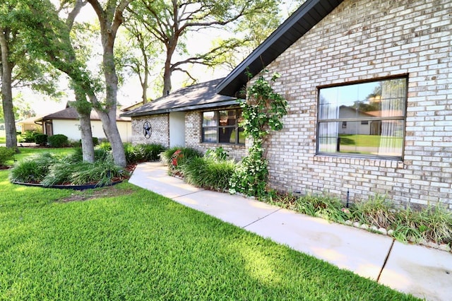 5351 SW 80th Pl, Ocala, FL 34476 - view of side of property featuring brick siding and a lawn