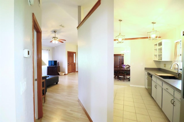 5351 SW 80th Pl, Ocala, FL 34476 - kitchen with a sink, white cabinets, dishwasher, glass insert cabinets, and pendant lighting