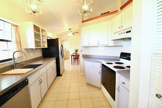 5351 SW 80th Pl, Ocala, FL 34476 - kitchen with appliances with stainless steel finishes, under cabinet range hood, a sink, tasteful backsplash, and light tile patterned flooring