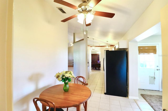 5351 SW 80th Pl, Ocala, FL 34476 - dining space with vaulted ceiling, light tile patterned floors, ceiling fan, and baseboards