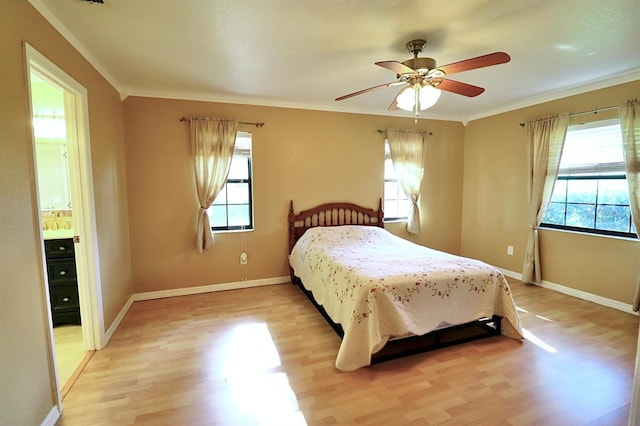 5351 SW 80th Pl, Ocala, FL 34476 - bedroom featuring light wood-type flooring, ornamental molding, baseboards, ceiling fan, and ensuite bathroom