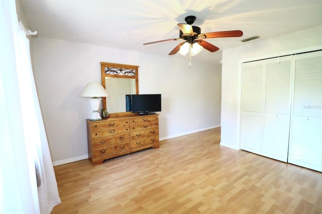 5351 SW 80th Pl, Ocala, FL 34476 - bedroom with light wood-style floors, a closet, baseboards, and ceiling fan