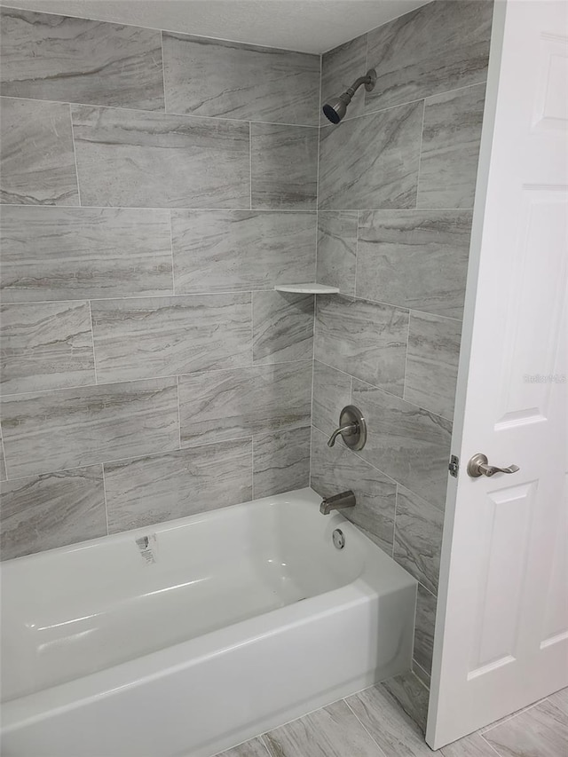 full bathroom with shower / washtub combination