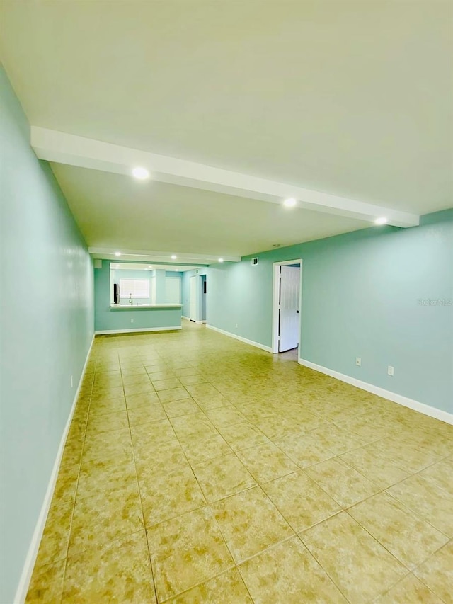 empty room with recessed lighting, baseboards, and tile patterned floors