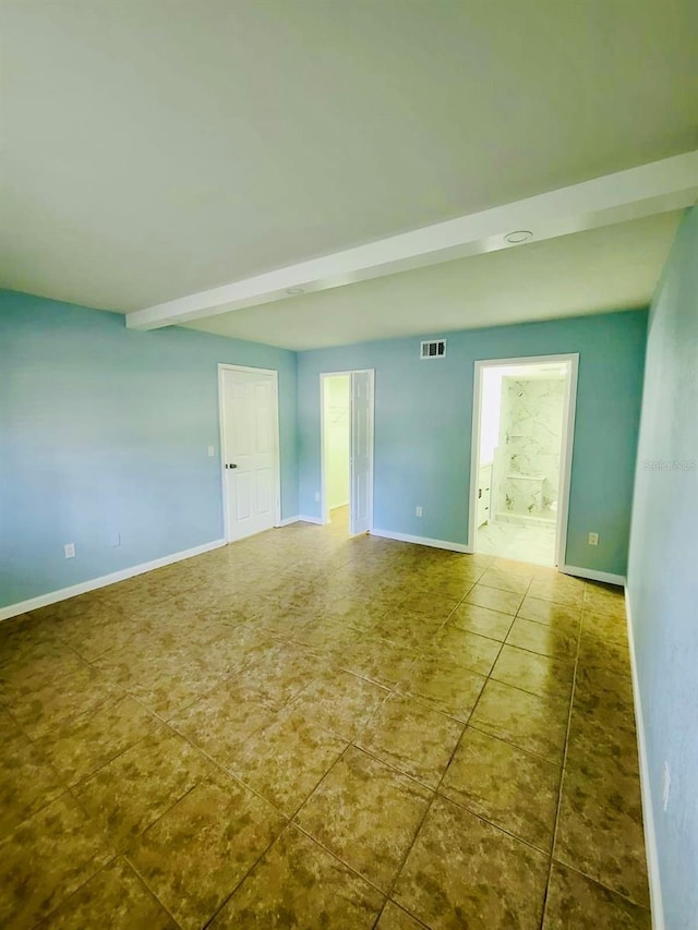 tiled empty room with baseboards