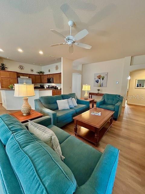 3023 Charlevoix St, The Villages, FL 32163 - living area featuring ceiling fan, light wood finished floors, recessed lighting, and baseboards