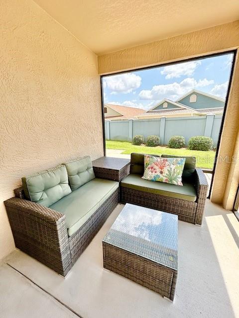 3023 Charlevoix St, The Villages, FL 32163 - view of patio / terrace with fence and an outdoor living space