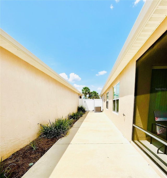 3023 Charlevoix St, The Villages, FL 32163 - view of patio / terrace featuring fence and cooling unit