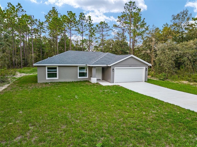 23163 NW Shamrock Ave, Dunnellon, FL 34431 - view of front of house featuring a garage, a front yard, concrete driveway, and stucco siding
