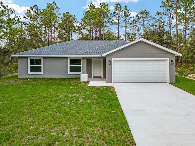23163 NW Shamrock Ave, Dunnellon, FL 34431 - ranch-style house featuring roof with shingles, a front yard, a garage, and driveway