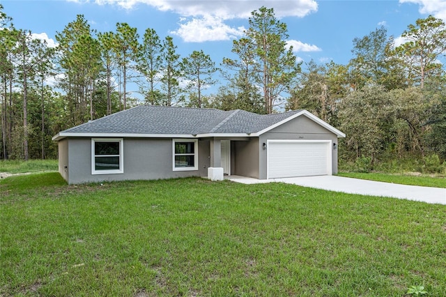23163 NW Shamrock Ave, Dunnellon, FL 34431 - view of front of home featuring a garage, a front lawn, concrete driveway, and stucco siding
