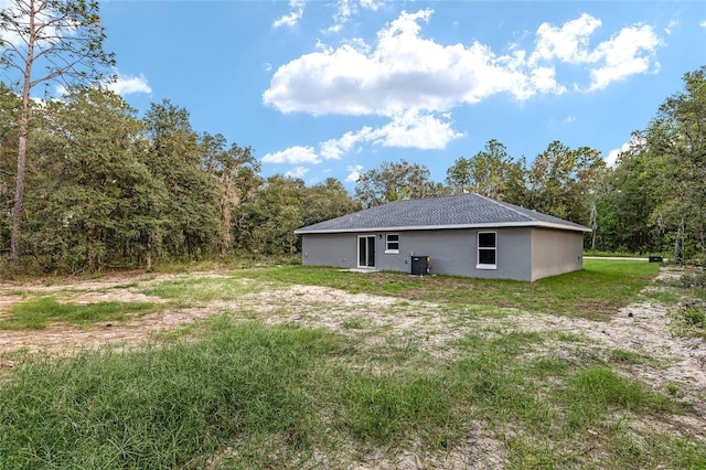 23163 NW Shamrock Ave, Dunnellon, FL 34431 - view of yard with cooling unit and a view of trees