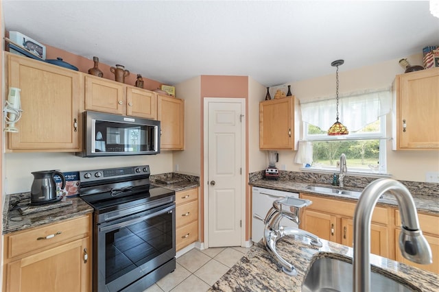 kitchen featuring stainless steel electric range oven, light brown cabinets, and a sink