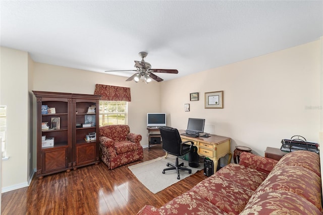 office with dark wood-type flooring, ceiling fan, and baseboards