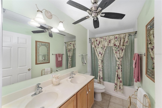 bathroom featuring a ceiling fan, tile patterned floors, toilet, shower / bath combo, and double vanity
