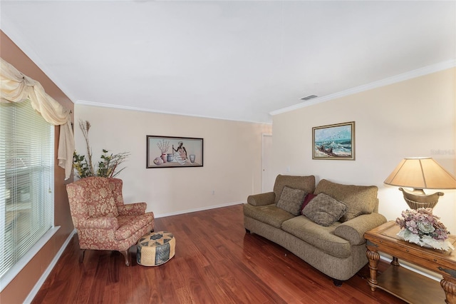 living area featuring baseboards, crown molding, and wood finished floors