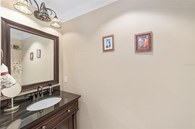 bathroom featuring ornamental molding and vanity