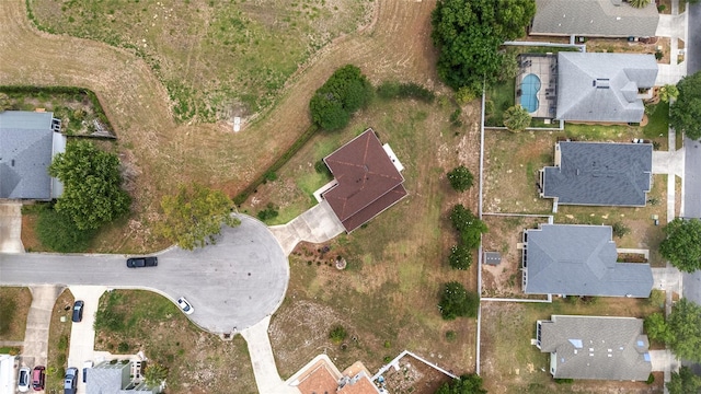 aerial view of property and surrounding area with nearby suburban area