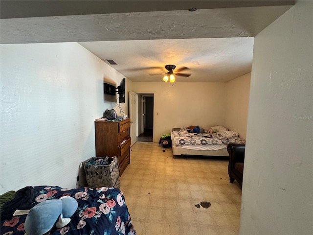 bedroom featuring light floors and ceiling fan