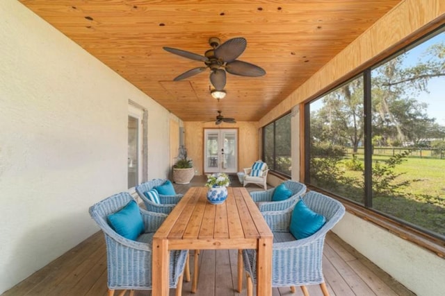 sunroom with french doors, healthy amount of natural light, and ceiling fan