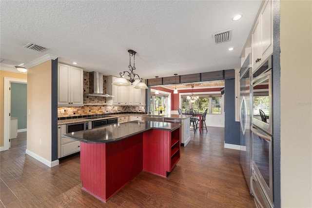 kitchen featuring wall chimney exhaust hood, baseboards, decorative backsplash, open shelves, and a textured ceiling