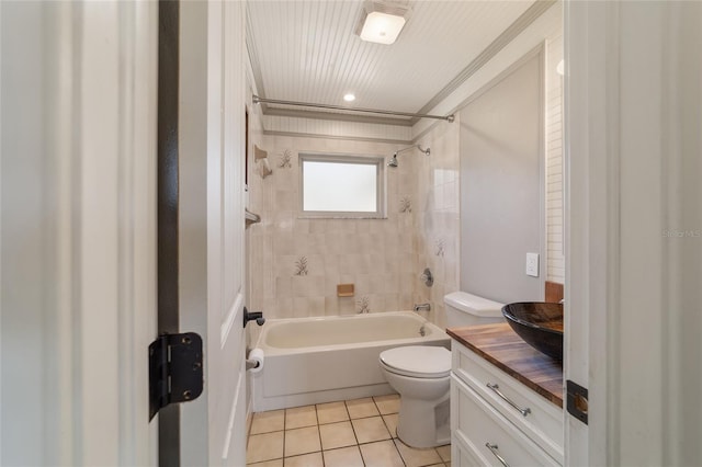 bathroom featuring tile patterned flooring, toilet, tub / shower combination, and vanity