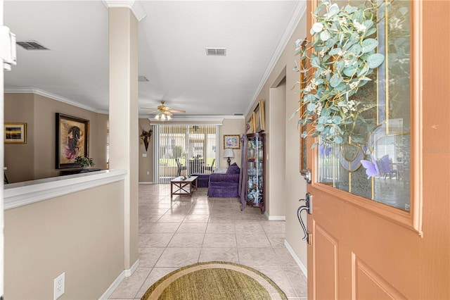 13885 Del Webb Blvd, Summerfield, FL 34491 - entryway with baseboards, ceiling fan, light tile patterned flooring, and crown molding