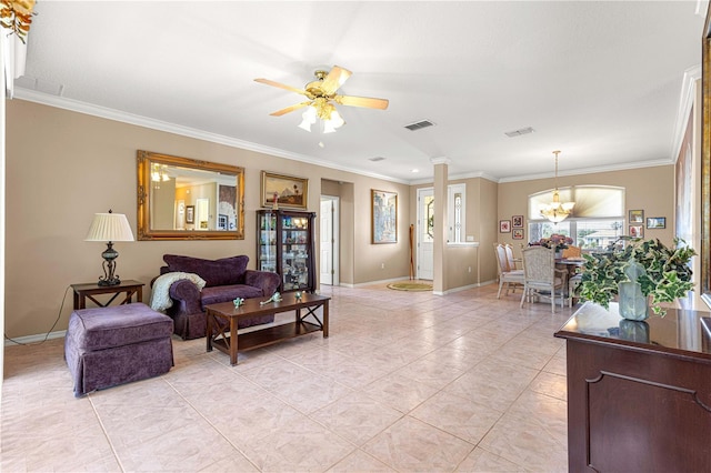 13885 Del Webb Blvd, Summerfield, FL 34491 - living room featuring ornamental molding, baseboards, a ceiling fan, ornate columns, and light tile patterned floors