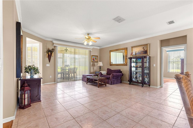 13885 Del Webb Blvd, Summerfield, FL 34491 - sitting room with ceiling fan, ornamental molding, light tile patterned floors, healthy amount of natural light, and baseboards