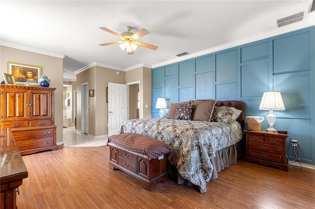13885 Del Webb Blvd, Summerfield, FL 34491 - bedroom with ornamental molding, light wood finished floors, baseboards, and ceiling fan