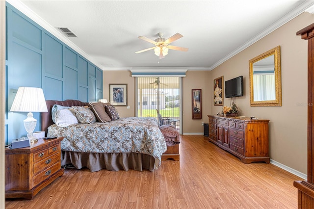 13885 Del Webb Blvd, Summerfield, FL 34491 - bedroom featuring access to exterior, light wood-style flooring, crown molding, and baseboards