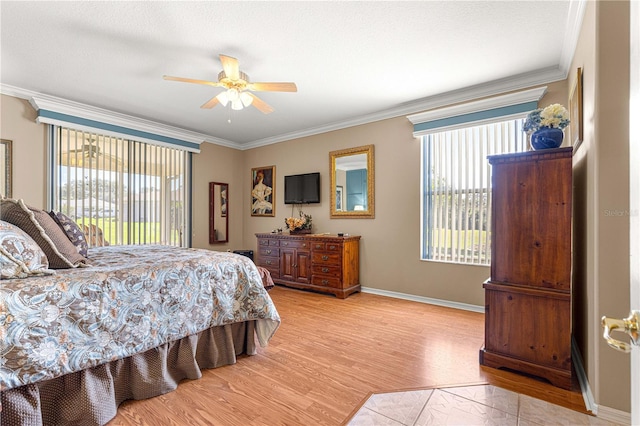 13885 Del Webb Blvd, Summerfield, FL 34491 - bedroom featuring ornamental molding, light wood-style flooring, baseboards, a ceiling fan, and access to outside