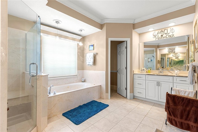 13885 Del Webb Blvd, Summerfield, FL 34491 - bathroom featuring a shower stall, a garden tub, vanity, tile patterned floors, and ornamental molding