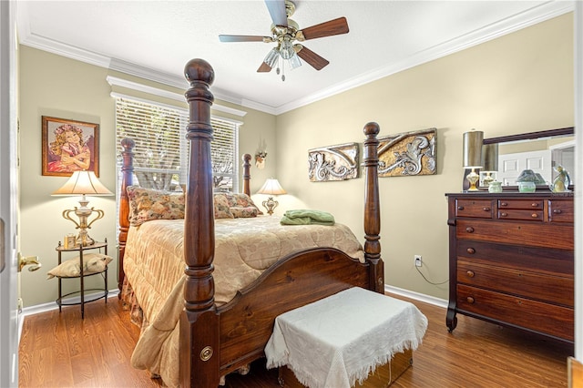 13885 Del Webb Blvd, Summerfield, FL 34491 - bedroom featuring baseboards, wood finished floors, crown molding, and ceiling fan