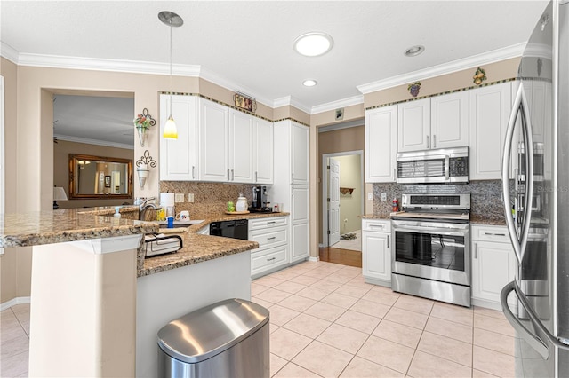 13885 Del Webb Blvd, Summerfield, FL 34491 - kitchen with appliances with stainless steel finishes, a peninsula, light tile patterned floors, a sink, and crown molding