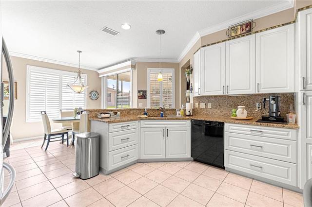 13885 Del Webb Blvd, Summerfield, FL 34491 - kitchen with black dishwasher, a peninsula, ornamental molding, and white cabinets