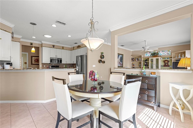 13885 Del Webb Blvd, Summerfield, FL 34491 - dining room featuring light tile patterned flooring, a ceiling fan, recessed lighting, and crown molding