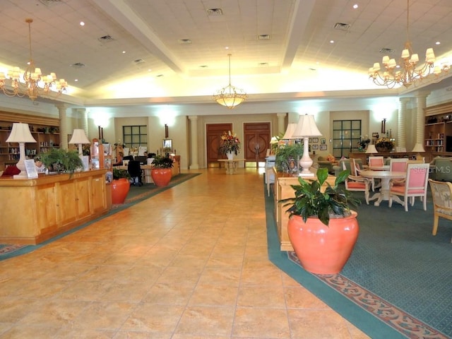 13885 Del Webb Blvd, Summerfield, FL 34491 - reception area with a chandelier, vaulted ceiling, and decorative columns