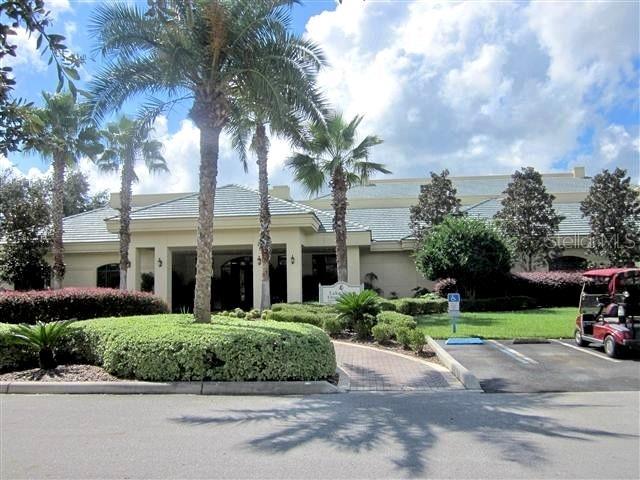 13885 Del Webb Blvd, Summerfield, FL 34491 - view of property featuring uncovered parking