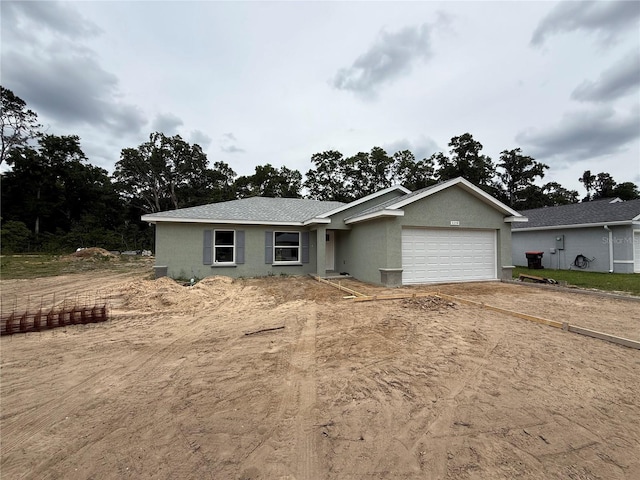 5359 NW 55th Pl, Ocala, FL 34482 - view of front of home featuring a garage, driveway, and stucco siding