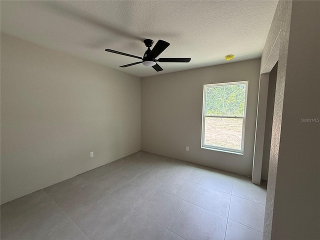 5359 NW 55th Pl, Ocala, FL 34482 - unfurnished room featuring light tile patterned floors, a ceiling fan, and a textured ceiling