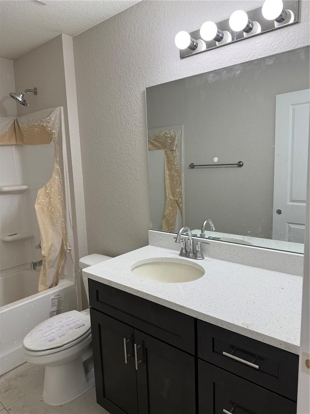 5359 NW 55th Pl, Ocala, FL 34482 - bathroom with vanity, toilet, a textured ceiling, shower / tub combo with curtain, and a textured wall